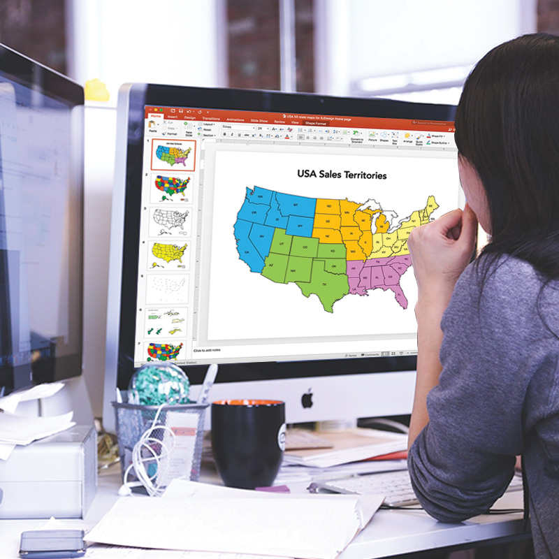 usa map presentation being created in PowerPoint with a woman at a desk